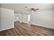 Spacious living room with new floors, modern ceiling fan, and neutral paint at 33830 S Haines Creek Rd, Leesburg, FL 34788