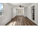 Spacious living room featuring wood-look floors and a ceiling fan at 33830 S Haines Creek Rd, Leesburg, FL 34788
