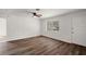 Bright living room with laminate flooring, a ceiling fan, and a window at 33830 S Haines Creek Rd, Leesburg, FL 34788