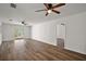 Spacious living room with new laminate flooring and natural light through a sliding glass door at 33830 S Haines Creek Rd, Leesburg, FL 34788