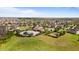 Expansive aerial view of a residential community featuring a pool, clubhouse, playground, and lush green spaces at 3936 Parkhouse Dr, Orlando, FL 32824