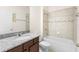 A bathroom featuring a bathtub, toilet and marble vanity at 3936 Parkhouse Dr, Orlando, FL 32824