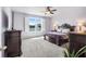 Comfortable bedroom offering lake view, plush carpeting and natural light at 3936 Parkhouse Dr, Orlando, FL 32824