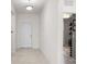 Welcoming foyer with neutral tile flooring and a bright white front door at 3936 Parkhouse Dr, Orlando, FL 32824