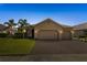 Beautiful single-story home with a spacious brick driveway and well-manicured front yard at 3936 Parkhouse Dr, Orlando, FL 32824