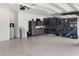 An organized garage with epoxy flooring, storage cabinets and tools neatly arranged at 3936 Parkhouse Dr, Orlando, FL 32824