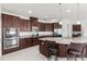 Gourmet kitchen featuring stainless steel appliances, double oven, and granite countertops at 3936 Parkhouse Dr, Orlando, FL 32824