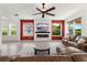 Bright and open living room featuring tile floors, comfortable seating, and a modern fireplace at 3936 Parkhouse Dr, Orlando, FL 32824