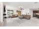 Spacious living room with tile flooring, comfortable seating, and a stylish center table at 3936 Parkhouse Dr, Orlando, FL 32824