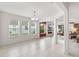 Inviting living room with fireplace, large windows, and tiled floors; great for entertaining at 3936 Parkhouse Dr, Orlando, FL 32824