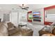 Inviting living room featuring tile floors, comfortable seating, and views of the open floorplan at 3936 Parkhouse Dr, Orlando, FL 32824