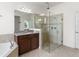 Bright bathroom with granite counters, frameless shower, and a soaking tub with tile surround at 3936 Parkhouse Dr, Orlando, FL 32824