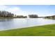 Scenic lake with a beautiful water fountain creates a peaceful view of the community at 3936 Parkhouse Dr, Orlando, FL 32824