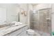 Neutral bathroom with granite counters, a glass shower stall and tasteful decor at 3966 Lana Ave, Davenport, FL 33897
