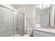 Modern bathroom featuring a walk-in shower with glass door, vanity with granite countertop, and modern fixtures at 3966 Lana Ave, Davenport, FL 33897