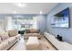 Stylish living room featuring plush seating, a sleek entertainment center, and bright, airy ambiance at 3966 Lana Ave, Davenport, FL 33897