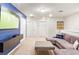 Upstairs living area with a comfortable sectional and wall-mounted entertainment at 3966 Lana Ave, Davenport, FL 33897