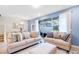 Comfortable living room with modern sofas, an ottoman, and sliding glass doors to the pool at 3966 Lana Ave, Davenport, FL 33897