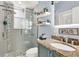 This updated bathroom offers stylish tile, glass enclosed shower, and granite countertops at 408 Almeria Ct, Winter Springs, FL 32708