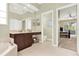 Bathroom offering a soaking tub, vanity, and access to the primary bedroom at 408 Almeria Ct, Winter Springs, FL 32708
