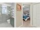 This bathroom seamlessly connects to the bedroom and features updated tiling and modern fixtures at 408 Almeria Ct, Winter Springs, FL 32708