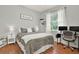 Comfortable bedroom with a work space, natural light and minimalist decor elements at 408 Almeria Ct, Winter Springs, FL 32708