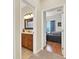 An airy secondary bedroom showcasing wood floors, a vanity with mirror, and natural light at 408 Almeria Ct, Winter Springs, FL 32708