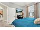 This bedroom boasts lots of natural light and a mounted TV for a relaxed viewing experience at 408 Almeria Ct, Winter Springs, FL 32708