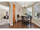Cozy dining area with a round table, chandelier, and views of the Primary bedroom at 408 Almeria Ct, Winter Springs, FL 32708