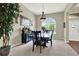 Dining room featuring a dark wood table and a window at 408 Almeria Ct, Winter Springs, FL 32708