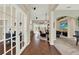 Open-concept interior showcasing hardwood floors, office with french doors, and an inviting living area at 408 Almeria Ct, Winter Springs, FL 32708