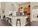 Spacious kitchen with wooden cabinetry and granite counters, complete with bar stool seating at 408 Almeria Ct, Winter Springs, FL 32708