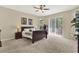 Spacious main bedroom features a ceiling fan, neutral tones, and sliding door access to the outdoors at 408 Almeria Ct, Winter Springs, FL 32708