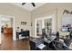 The office features french doors, hardwood floors, and lots of space for working from home at 408 Almeria Ct, Winter Springs, FL 32708