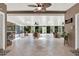 Spacious sunroom with ceiling fans, tile flooring, and many windows offering abundant natural light at 408 Almeria Ct, Winter Springs, FL 32708
