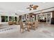 Stylish sunroom featuring seating, a dining table, and scenic views of the outdoors at 408 Almeria Ct, Winter Springs, FL 32708