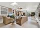 Comfortable sunroom featuring seating, a television, and access to the outdoors at 408 Almeria Ct, Winter Springs, FL 32708