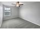 Cozy bedroom with neutral paint, a ceiling fan, and plush carpeting at 4346 Trotters Way, Lakeland, FL 33801
