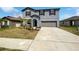 Attractive two-story home with well-maintained landscaping and a two-car garage at 4346 Trotters Way, Lakeland, FL 33801