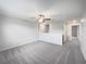 Bright upstairs loft area with soft carpeting, a ceiling fan, and open views at 4346 Trotters Way, Lakeland, FL 33801