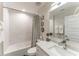 Well-lit bathroom featuring a shower-tub combination, modern vanity, and neutral wall colors at 4461 Summer Flowers Pl, Kissimmee, FL 34746