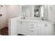 Bright bathroom with a double sink vanity, tile shower, and modern fixtures at 4461 Summer Flowers Pl, Kissimmee, FL 34746