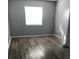 Bright bedroom features wood-style floors and neutral paint at 480 Banyon Tree Cir # 100, Maitland, FL 32751