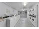 On-site laundry room featuring rows of well-maintained washing machines and dryers for resident convenience at 480 Banyon Tree Cir # 100, Maitland, FL 32751