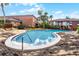 Beautifully maintained community pool featuring brick pavers, lounge chairs, and a relaxing atmosphere at 480 Banyon Tree Cir # 100, Maitland, FL 32751
