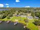 Expansive properties with private docks and well-manicured lawns provide an exclusive waterfront living experience at 49 Interlaken Rd, Orlando, FL 32804