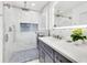 Bathroom with glass shower, marble countertops, and sleek, modern fixtures at 49 Interlaken Rd, Orlando, FL 32804