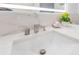 Bathroom sink with waterfall faucet, flowers, and countertop towels at 49 Interlaken Rd, Orlando, FL 32804