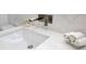 Modern bathroom sink featuring quartz countertop, brushed metal faucet, and decorative succulent at 49 Interlaken Rd, Orlando, FL 32804