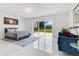 Spacious bedroom with a sliding glass door that opens to the backyard and natural light at 49 Interlaken Rd, Orlando, FL 32804